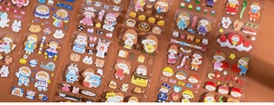 Detailed view of colorful cartoon girl stickers for scrapbooking and creative DIY crafts