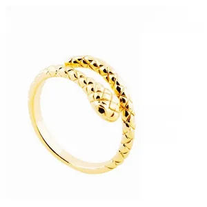 Macro detail of golden snake ring showing intricate scale texture and craftsmanship