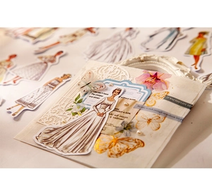 Close-up of vintage fashion style washi stickers featuring figures and golden butterflies