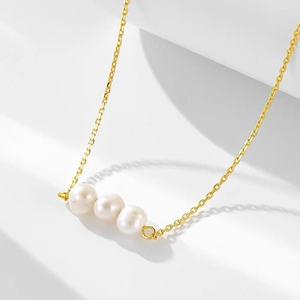 Elegant 925 silver necklace with three natural freshwater pearls on a gold-plated chain