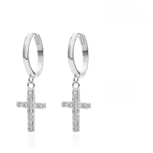Macro view of S925 sterling silver cross hoop earrings with inlaid cubic zirconia