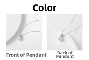 Detailed macro view showing the front and back of a round white pearl pendant on silver chain