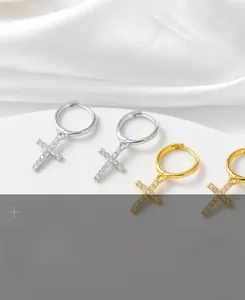 Close-up of S925 sterling silver cross hoop earrings with sparkling zircon stones