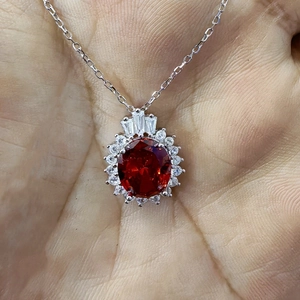 Elegant S925 sterling silver necklace with oval red zircon and crown-style pendant