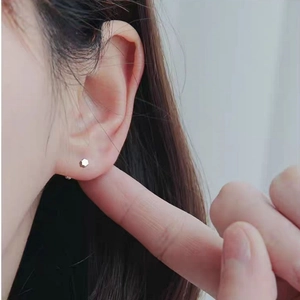 S925 sterling silver minimalist hexagonal stud earrings shown on model ear for daily wear