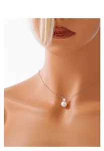 Detail of elegant S925 silver necklace with round white pearl and zircon on model