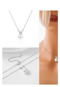 Detail view of S925 sterling silver stamp and round white pearl pendant necklace