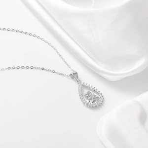 Detail of silver drop-shaped pendant with carved female portrait and zircon pave