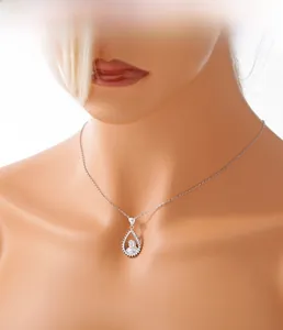 Detailed view of 925 sterling silver hollow portrait pendant with sparkling diamond setting