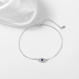 Elegant 925 sterling silver evil eye bracelet with blue zircon and silk background