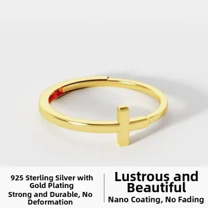 Macro shot of 925 sterling silver gold-plated ring featuring minimalist cross design