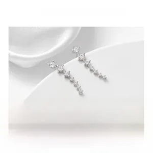 Macro detail of 925 sterling silver ear climbers with sparkling zircon stones