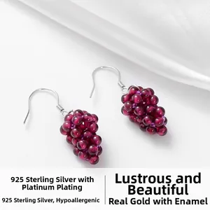 Detail of handmade grape-shaped garnet earrings with S925 sterling silver hooks