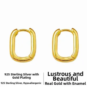 Close-up of 925 sterling silver gold plated U-shaped earrings with bright luster finish
