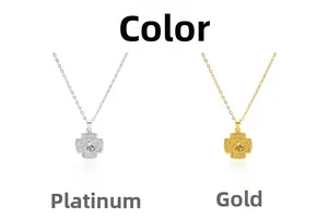 Detailed view of religious cross necklaces in gold and silver finish with embossed icons