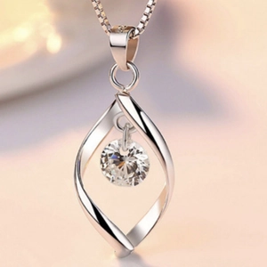 Rotating twisted silver necklace with a brilliant round zircon pendant on a box chain