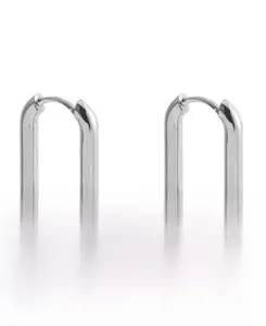 Macro shot of 925 sterling silver U-shaped hoop earrings with a polished geometric finish