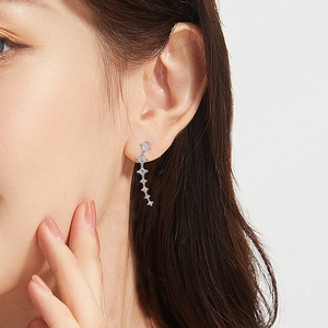 Elegant silver meteor tassel earrings with shimmering cubic zirconia in a minimalist style