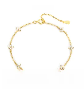 Detailed macro view of S925 sterling silver clover bracelet with diamond accents and S925 tag