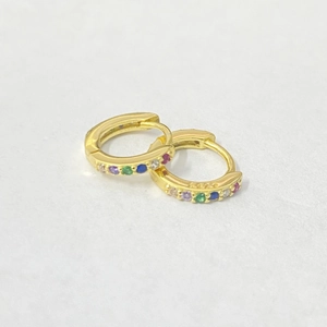 Close-up of S925 sterling silver gold hoop earrings with colorful zircon stones