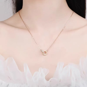 Elegant rose gold interlocking double circle necklace with micro-pave stones on model