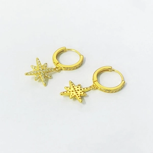 Gold eight-pointed star earrings with white cubic zirconia inlays and crystal pavé hoops