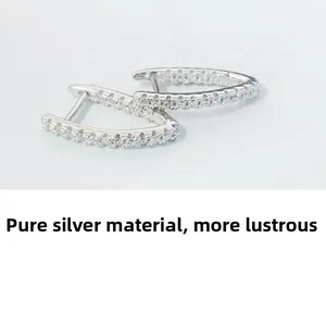 Detail of S925 sterling silver V-shaped earrings with micro-pave cubic zirconia crystals