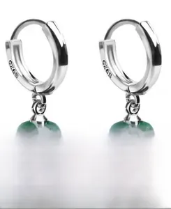 Detailed view of S925 sterling silver hoop earrings with green agate stone pendants