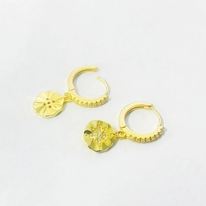 Gold starburst huggie hoop earrings with micro-pave crystals and vintage sunburst pendant