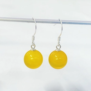 Elegant S925 silver hook earrings with round yellow agate beads on white background