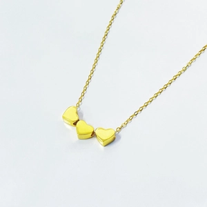 Gold S925 sterling silver necklace featuring three layered 3D heart-shaped pendants