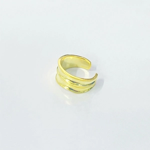 Detailed view of wide layered gold ripple ring with adjustable open design and metallic shine