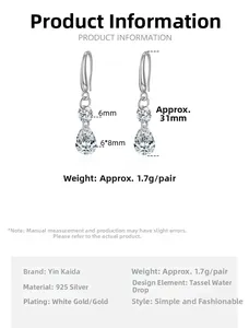 Macro detail of S925 silver pear cut zircon drop earrings with size measurement labels
