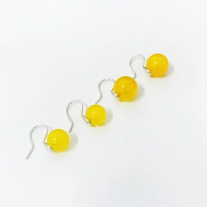 Close-up of yellow agate beads on S925 silver hooks, elegant Chinese style earrings