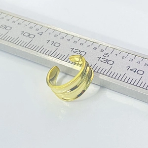 Minimalist S925 sterling silver wavy wide band ear cuff in golden finish shown with ruler