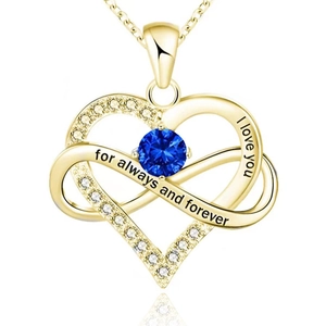 Close-up of golden heart and infinity necklace with blue stone and love engravings