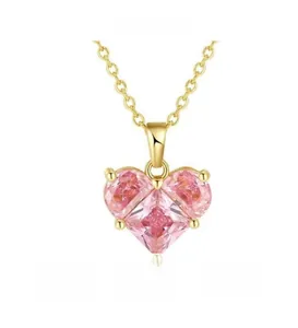 Close-up of pink heart zircon pendant on fine gold chain with secure prong setting