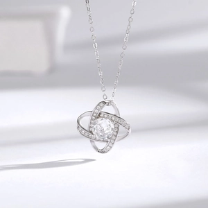 Elegant S925 silver necklace with interlocking hollow clover pendant and sparkling crystals