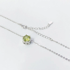 S925 sterling silver necklace with light green round gemstone and six-prong setting