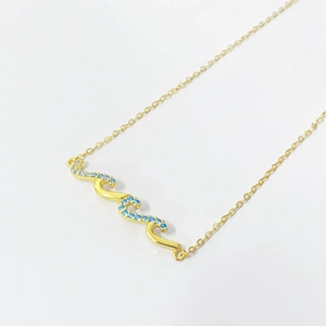 Elegant S925 sterling silver wave pendant necklace with blue pavé diamonds in gold plating