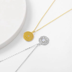 Detailed macro view of S925 sterling silver evil eye pendants in gold and silver finishes