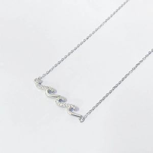 Elegant S925 silver wave pendant necklace with sparkling blue diamonds on a thin chain