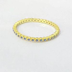 Elegant gold-plated S925 silver ring with blue zirconia stones in a minimalist pave setting