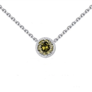 Detailed macro of S925 silver necklace with peridot green zircon in rope-textured pendant