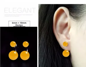Detail of S925 silver yellow agate double bead earrings with 6mm and 10mm spheres