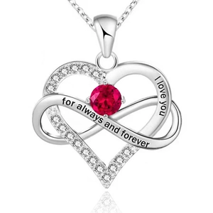 Macro shot of 925 silver infinity heart necklace with red stone and I love you engraving