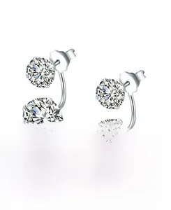 Detailed macro view of 925 silver U-shaped earrings with double cubic zirconia stones