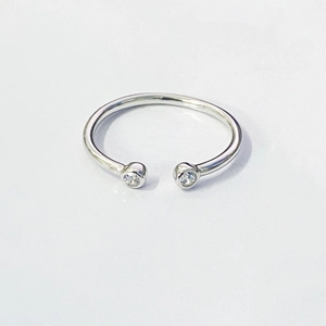 Minimalist S925 sterling silver open ring with dual zircon stones on white background