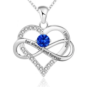 Macro detail of 925 silver heart infinity necklace with blue gemstone and engraving