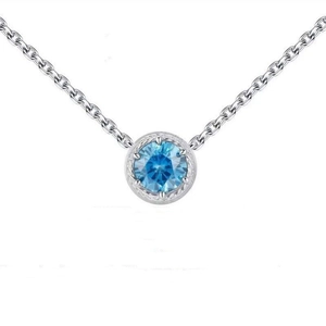 Macro shot of silver S925 necklace with round sky blue zircon and twisted rope border